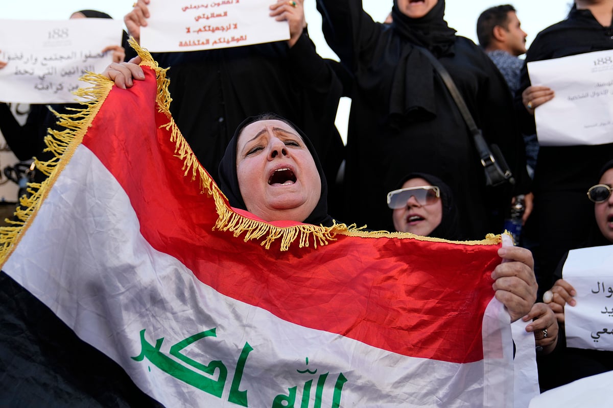 AP : Protesters gather to demonstrate against a proposed law to permit underage female marriage in Tahrir Square in Baghdad, Iraq, Thursday, Aug. 8, 2024. 


